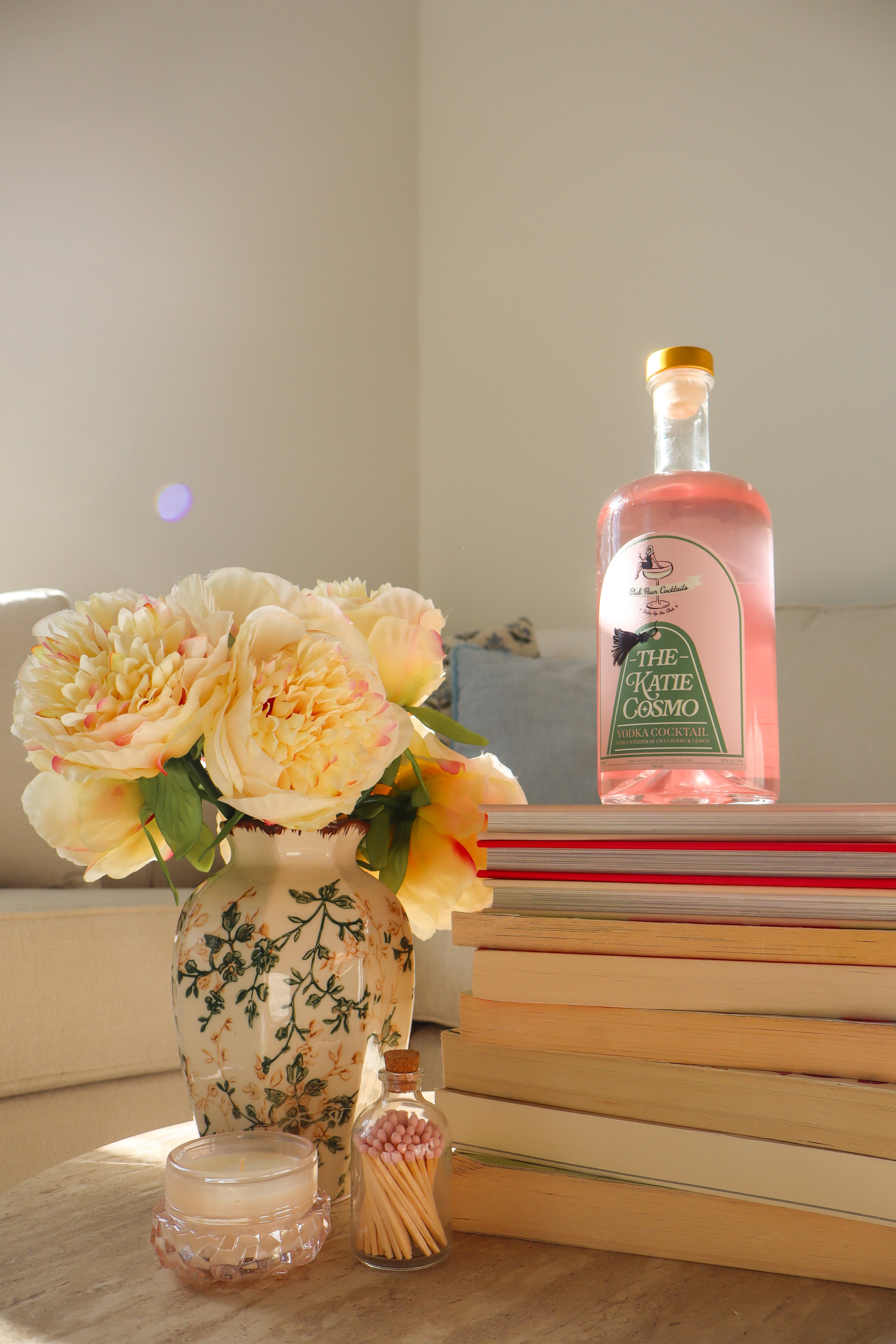 Peach peonies with Katie Cosmo vodka bottle
